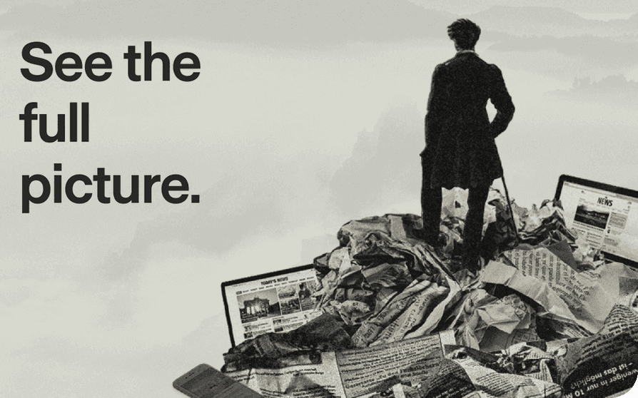 See the full picture — a reader standing on a pile of newspapers